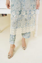 Women wearing a floral dress with a white background and piano