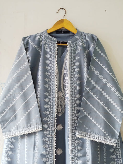 Decorative jacket with intricate patterns on a hanger against a plain background